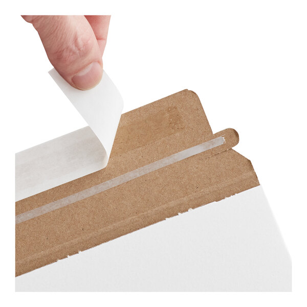 A white self-sealing rigid mailer with a peel-and-seal adhesive strip being opened.