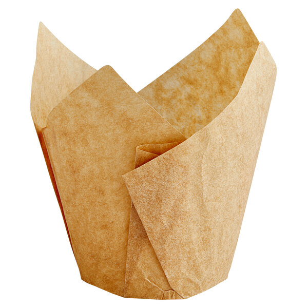 An Enjay unbleached brown tulip baking cup on a white background.