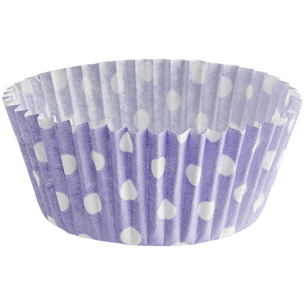A purple and white polka dot cupcake wrapper.