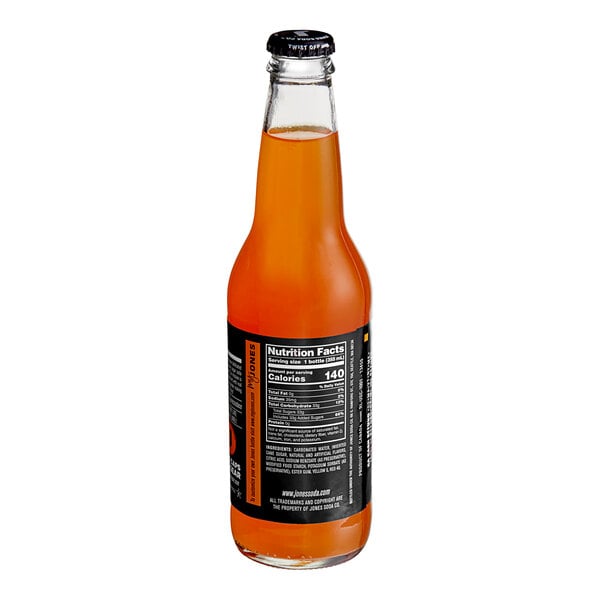 A Jones Orange & Cream Soda bottle with orange liquid and a label.