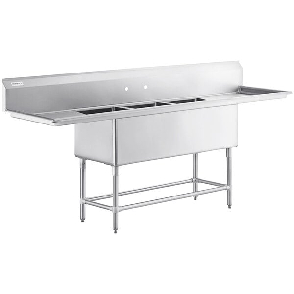 A Regency stainless steel three compartment sink with 2 drainboards.