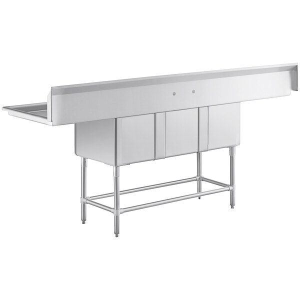 A Regency stainless steel three compartment sink with two drainboards.