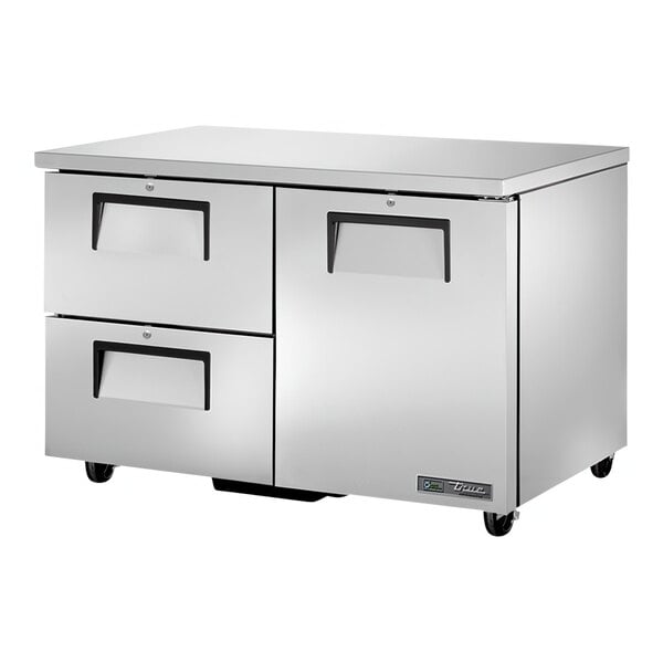 A True silver undercounter refrigerator with one door and two drawers.