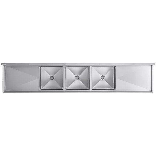 A Regency stainless steel three compartment commercial sink with 2 drainboards.