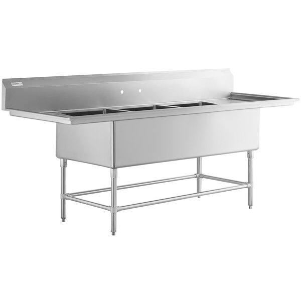 a stainless steel sink with four compartments