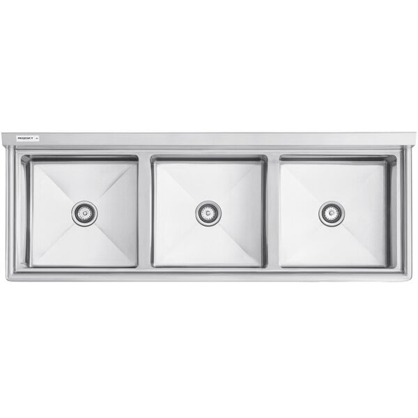 A Regency stainless steel three compartment sink with three 20 inch by 20 inch bowls.