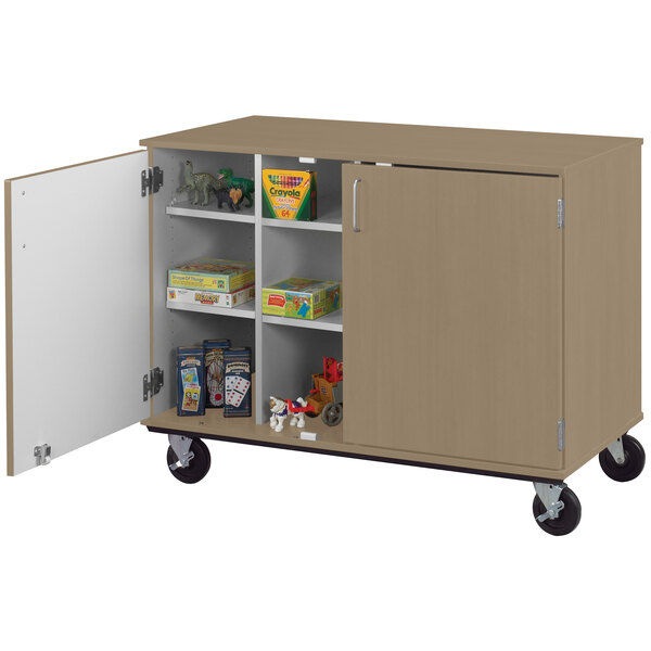 An I.D. Systems mobile cubbie storage cart with open doors.