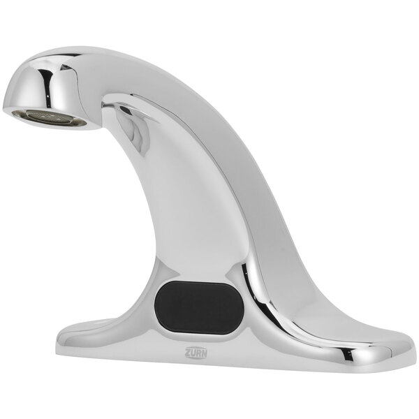 a silver faucet with a black button