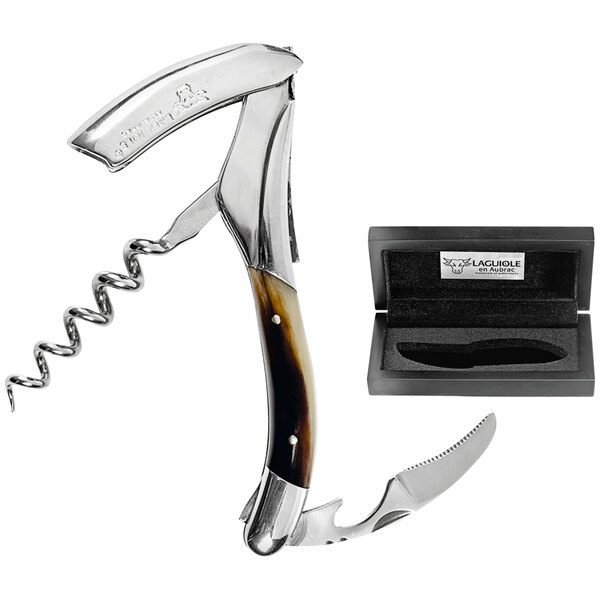 A Laguiole En Aubrac brown horn waiter's corkscrew with a knife and a box.