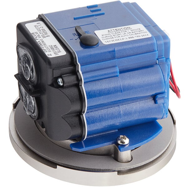 A blue and black Sloan G2 sensor assembly with white labels and wires.