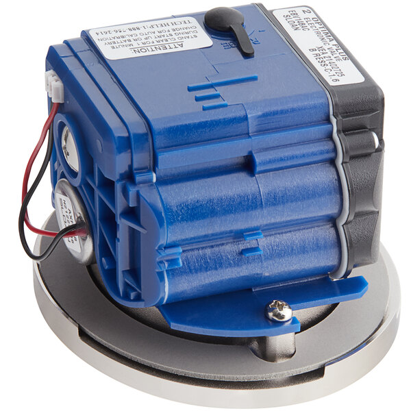 A blue and black Sloan G2 sensor assembly with wires.