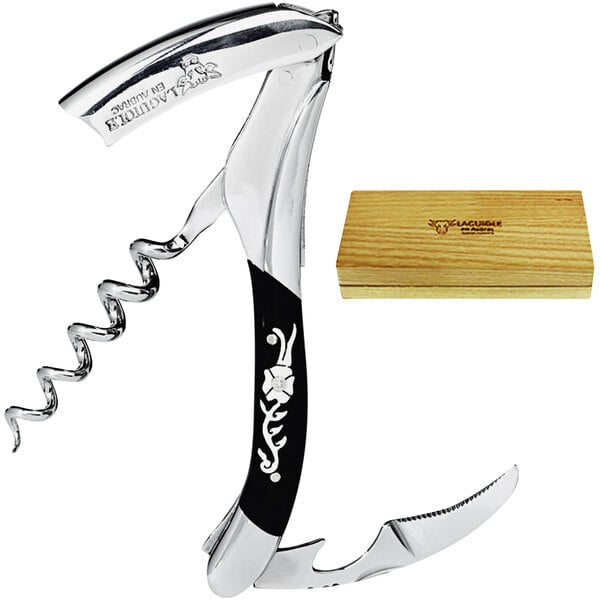 A Laguiole En Aubrac Diamond Flower Waiter's Corkscrew with a black handle in a wooden box.