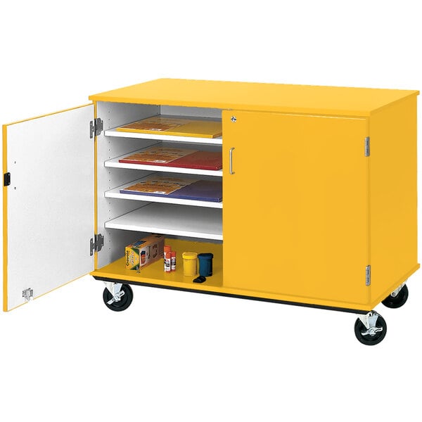 A yellow slotted storage cart with a locking door.