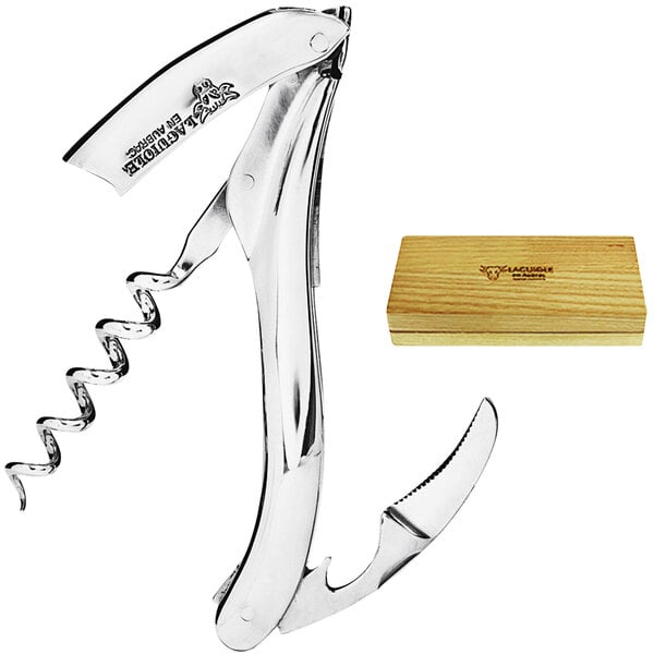 A Laguiole En Aubrac polished stainless steel waiter's corkscrew in a wooden box.