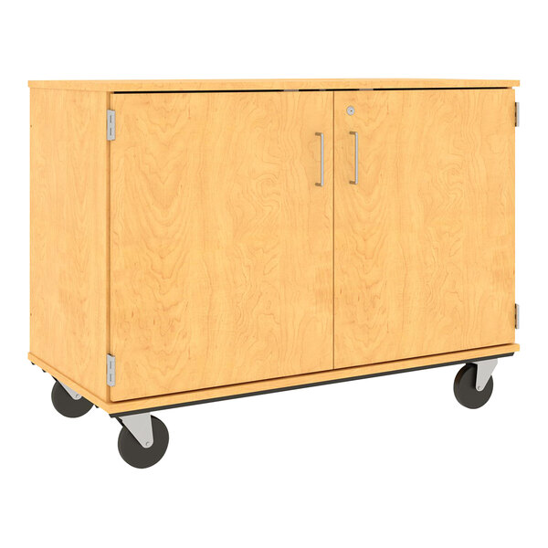 A wooden I.D. Systems storage cabinet with two doors and black wheels.