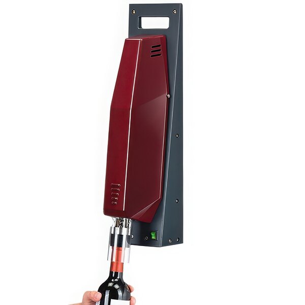 A hand using a Franmara ElectroParagon wall-mounted electric uncorking machine to open a bottle of wine.