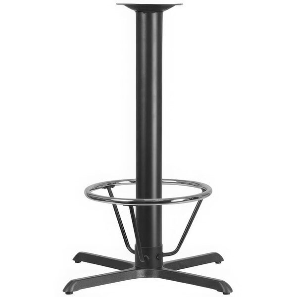 A black metal Flash Furniture bar height table base with a round metal foot rest.