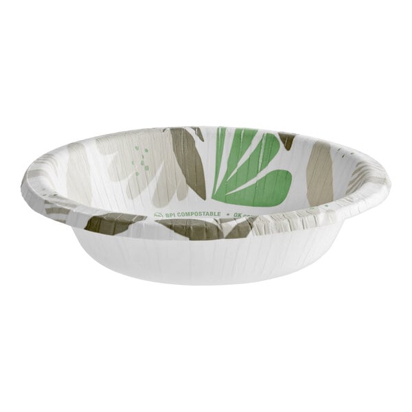 A heavy weight paper bowl with a green and beige leaf pattern on the inside.