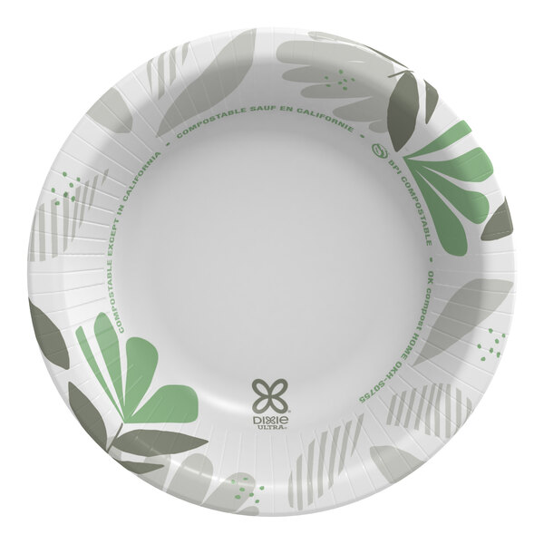 A white paper bowl with green leaves on it.