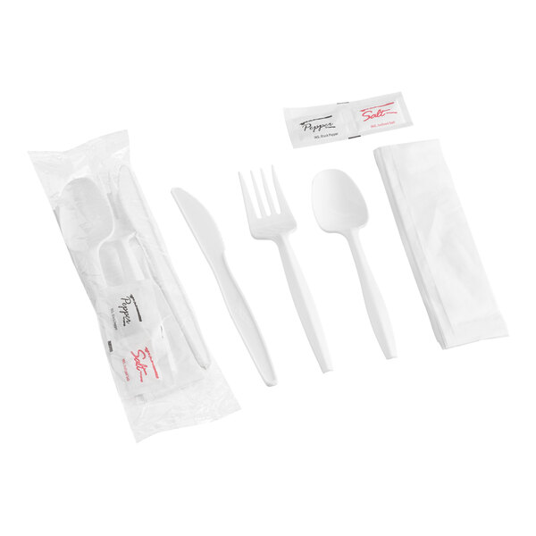 A set of white plastic cutlery including a knife, fork, spoon, a napkin, and packets of salt and pepper, with one set shown wrapped in plastic packaging.