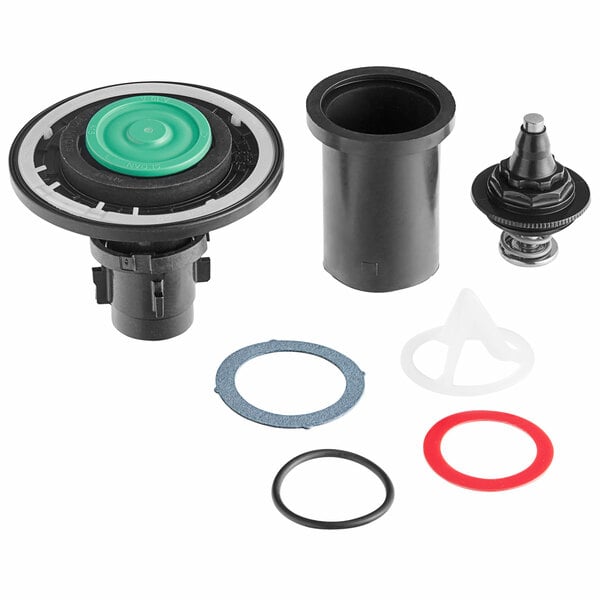 A Sloan Royal urinal rebuild kit with black and green machine parts and rubber seals.