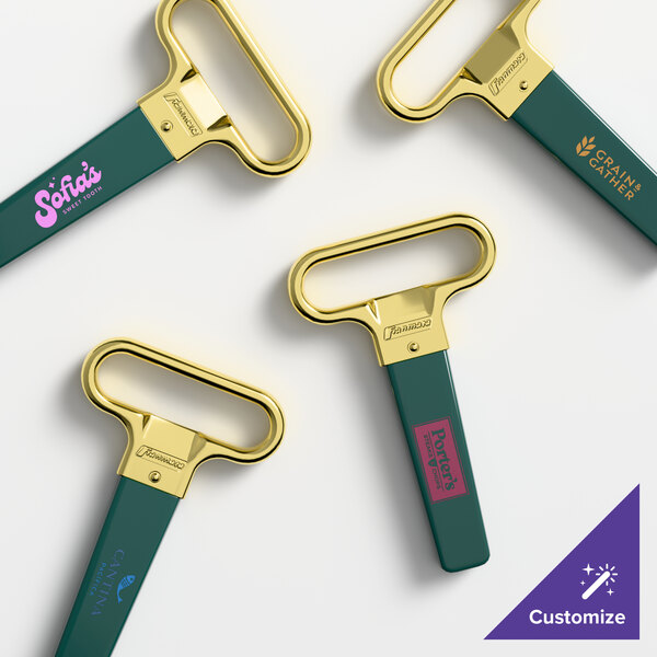 A set of brass-plated two-prong cork extractors with dark green sheaths, each featuring customizable branding.