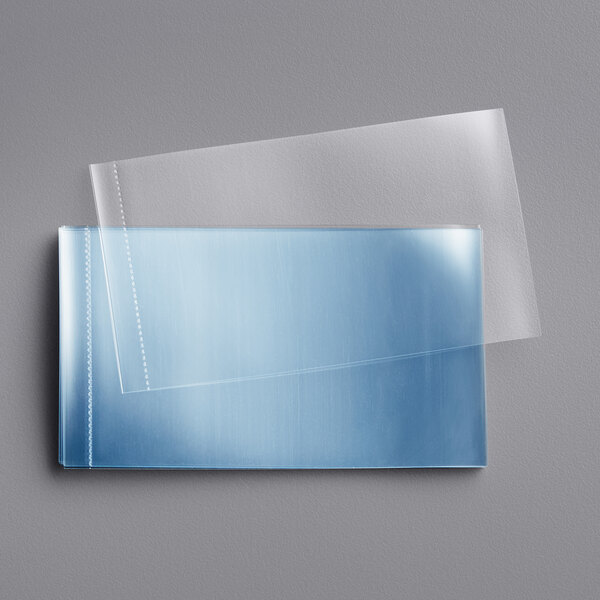 Clear perforated shrink bands on a white surface.