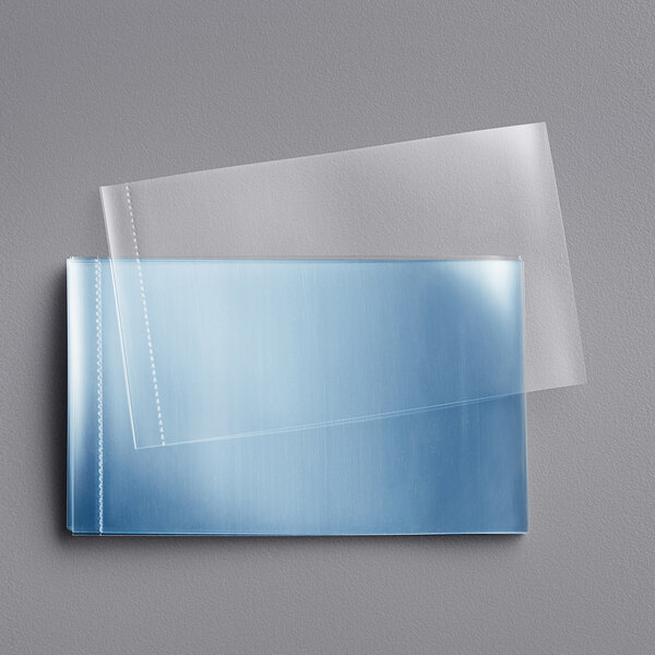 A close-up of a clear plastic shrink band with perforations.