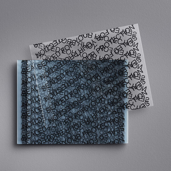 A plastic bag of white perforated shrink bands with black lettering.