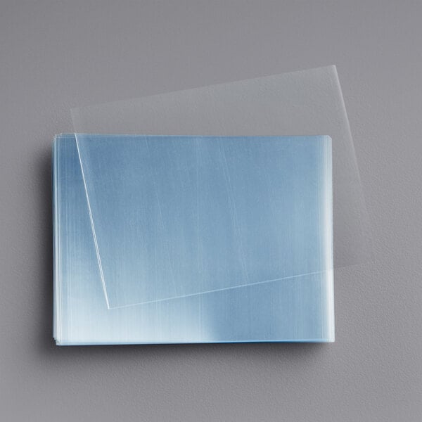 A clear plastic sheet on a white surface.