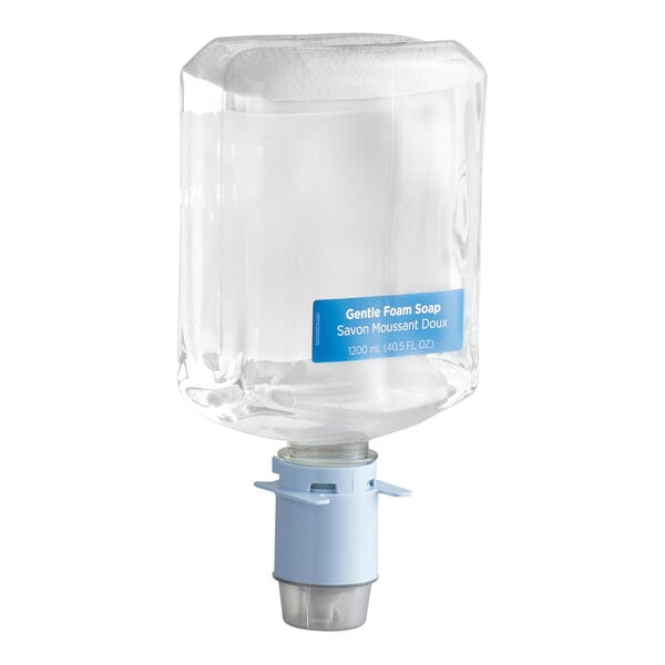 A clear rectangular container with a blue label and a blue dispensing mechanism at the bottom, filled with liquid soap.