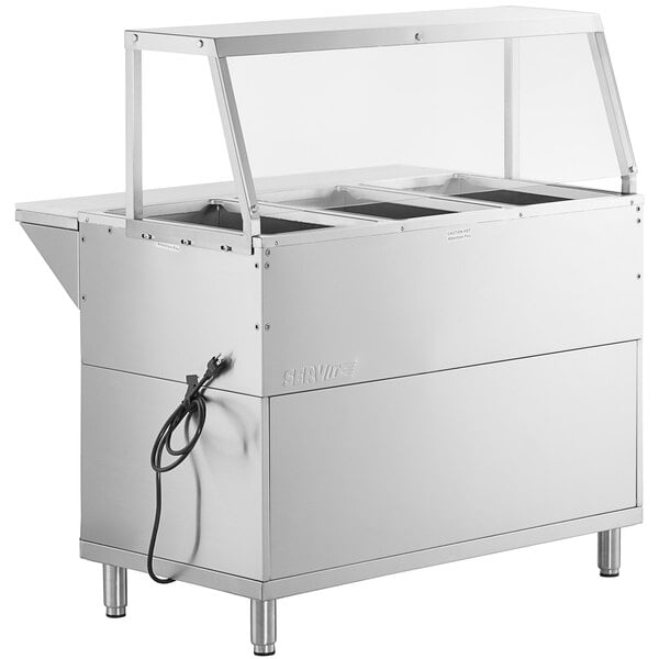 A ServIt stainless steel electric steam table with an angled glass sneeze guard.