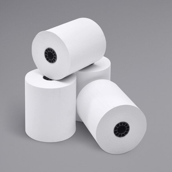 A stack of Point Plus white thermal paper rolls.