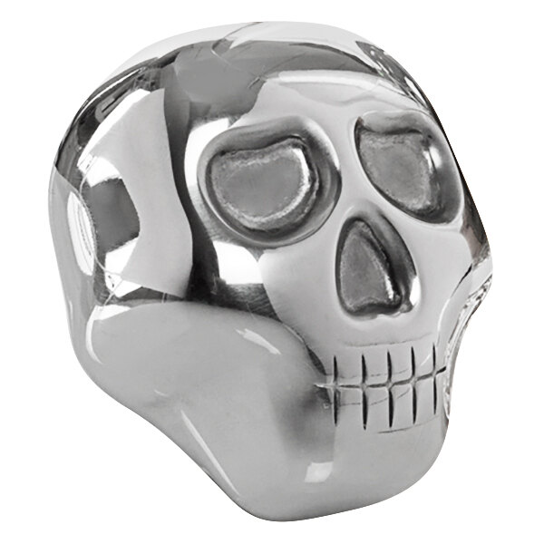 A Franmara stainless steel skull-shaped ice mold on a table.