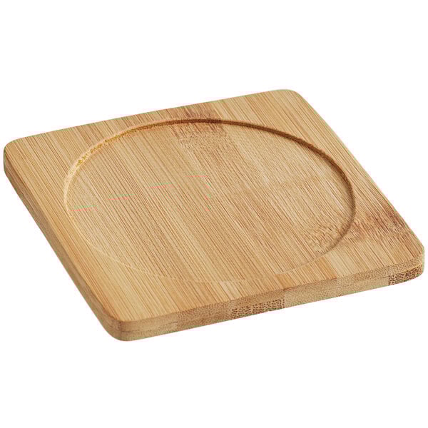 A wooden square Franmara wine coaster with a circle in the middle.