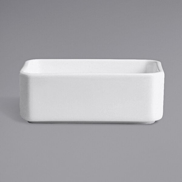 A white rectangular RAK Porcelain sugar packet holder.