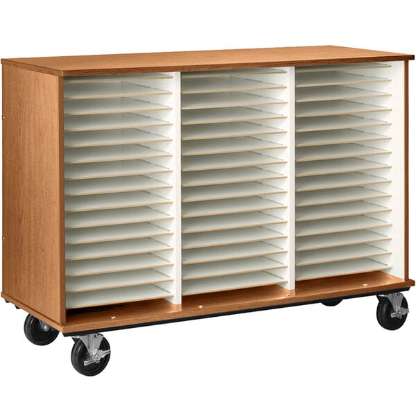 A wooden I.D. Systems cabinet with medium cherry shelves and several compartments on wheels.