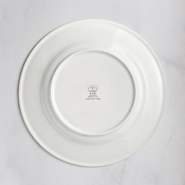 A RAK Porcelain ivory porcelain plate with an embossed crown logo.