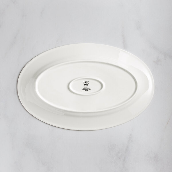 A RAK Porcelain ivory porcelain oval plate with an embossed oval design.
