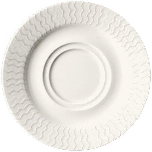 A RAK Porcelain ivory porcelain saucer with an embossed wavy design.