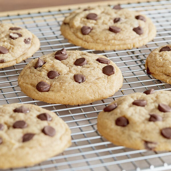 A Van Leer semi-sweet chocolate chip cookie on a cooling rack.