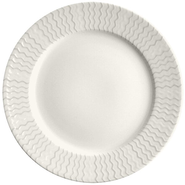 A RAK Porcelain ivory porcelain plate with wavy lines on the rim.