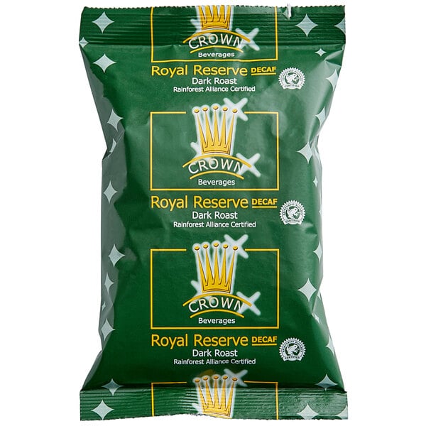 A green Crown Beverages Royal Reserve Sumatra Decaf Coffee packet with white and yellow text.