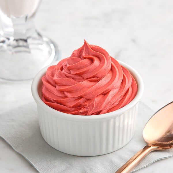 a bowl of pink frosting