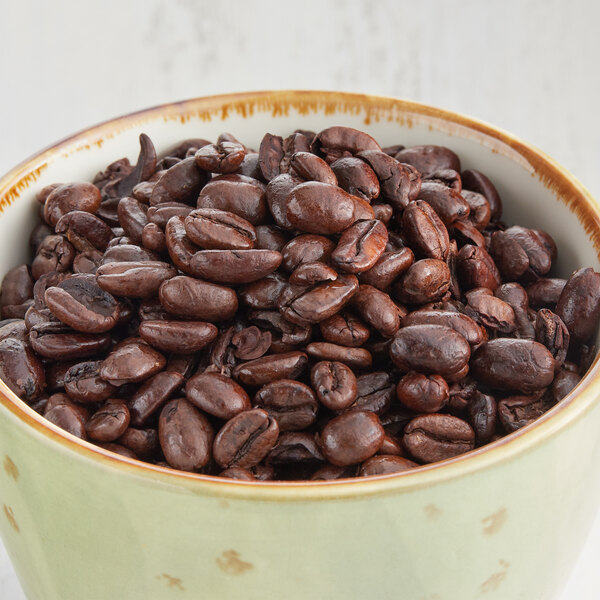 A bowl of Crown Beverages Royal Reserve Sumatra Decaf whole bean coffee.