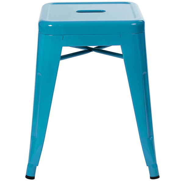 A teal metal backless stackable stool with square legs.