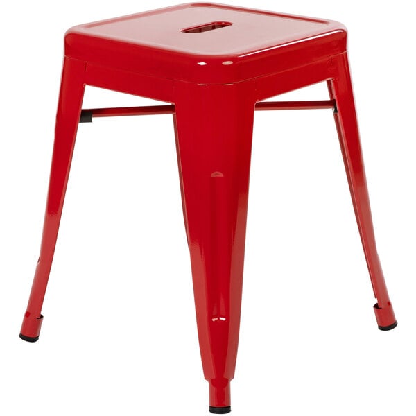 A Flash Furniture red metal backless stool with legs.