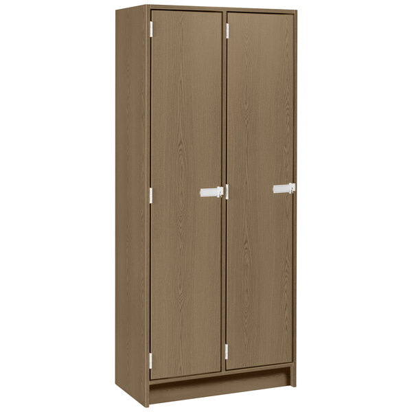 A brown wooden double door locker with two shelves.