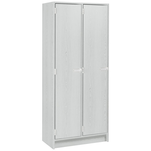 a white cabinet with three doors