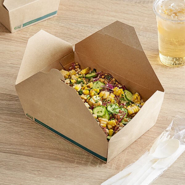 A Kraft EcoChoice take-out box of food and drink on a table.